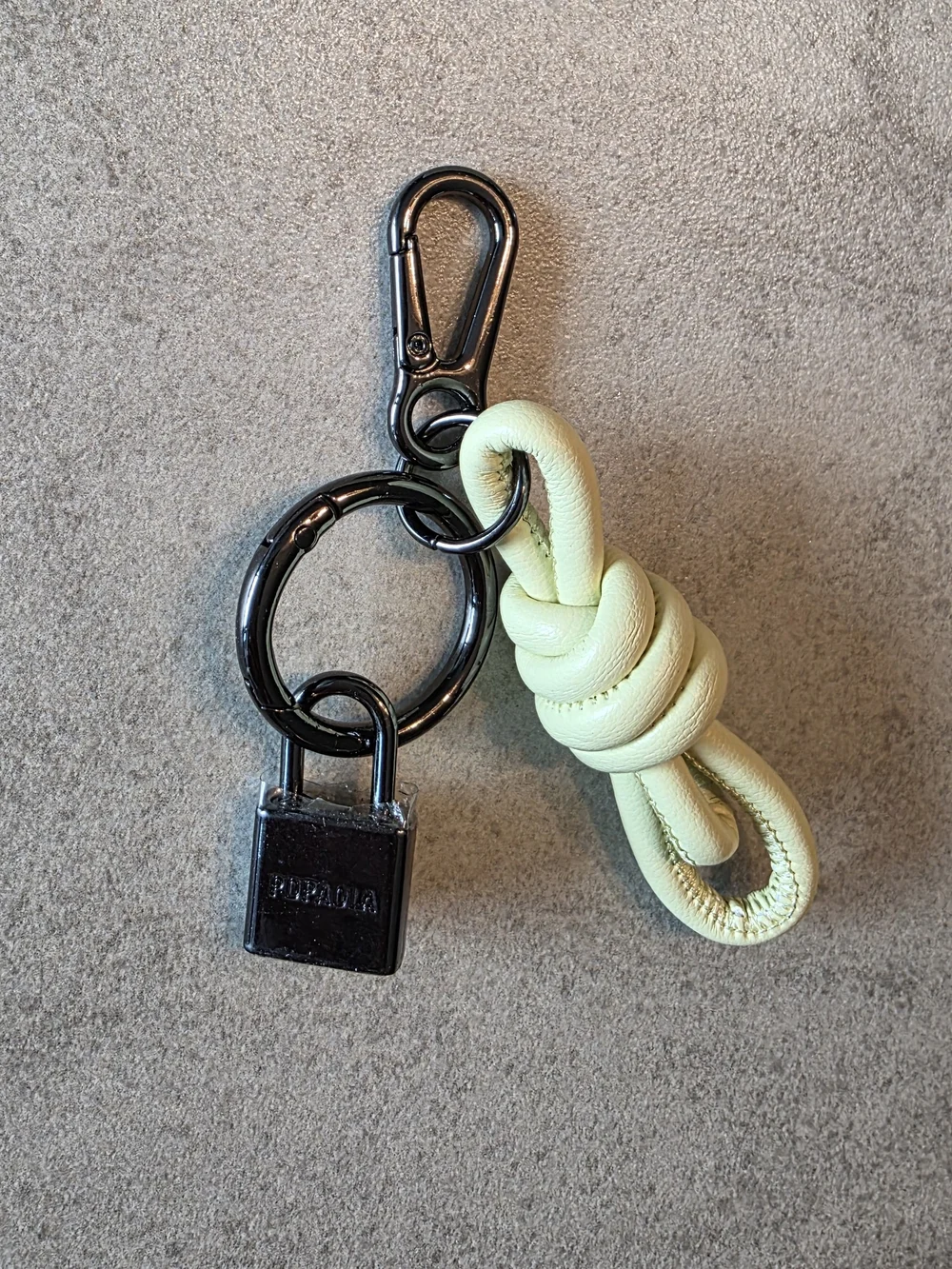 PDPaola Cream Leather Knot Keychain with Black Metal Ring and Padlock